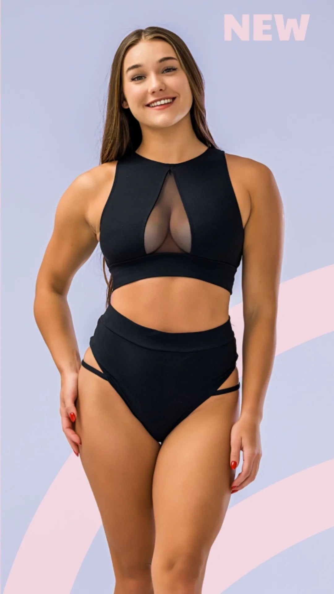 Model in a stylish black pole dance outfit featuring cut-out details, perfect for pole dance enthusiasts.